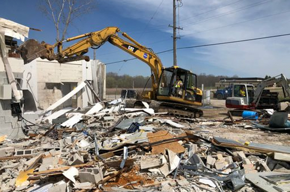 demolition contractors tearing down a building